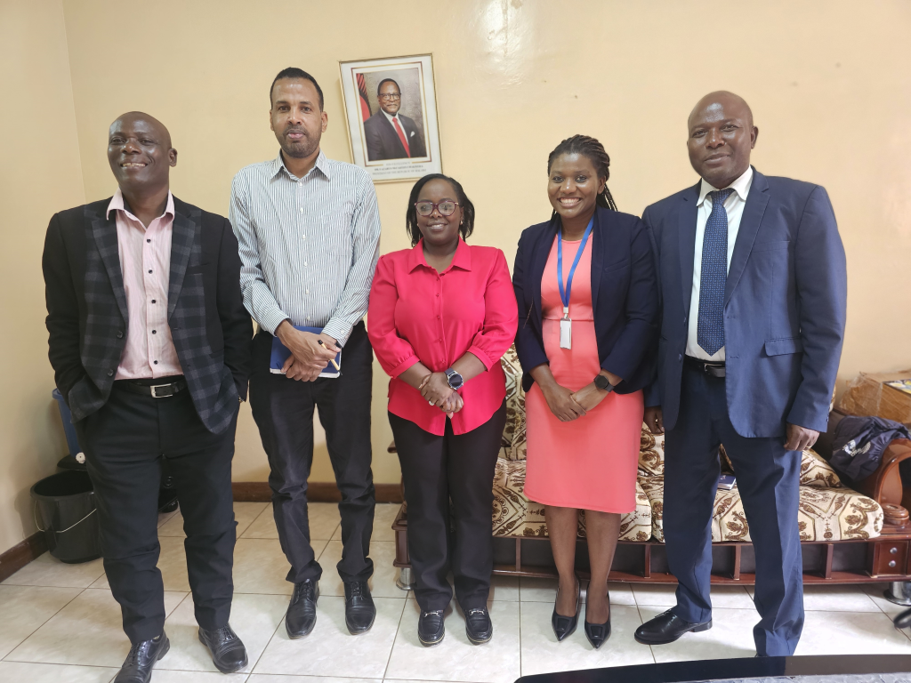 Mr Ishmael Bashir, standing next to Mr Henry Limula during his official welcoming by the Deputy Director responsible for NPHL.